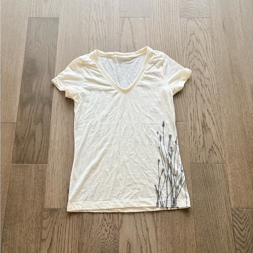 Icebreaker Cream V-Neck Short Sleeve Tee with Gray Botanical Detail